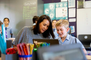 A Sydney Catholic schools' teacher helping a student in class